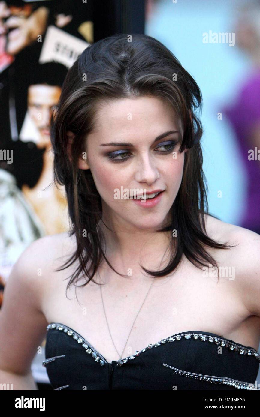 Kristen Stewart attends the Los Angeles premiere of LOVE RANCH. Sporting a black dress and matching nail polish, Kristen seems still to be uncomfortable on the red carpet. The actress was also wearing a simple gold band on her left hand next to her wedding ring finger. Recent reports are that her beau Robert Pattinson is ready to pop the question. Los Angeles, CA. 6/23/10. Stock Photo
