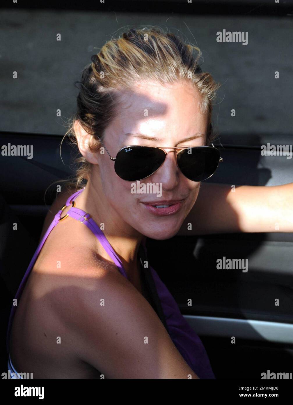 "The Hills" star Kristin Cavallari wears a purple top paired with a