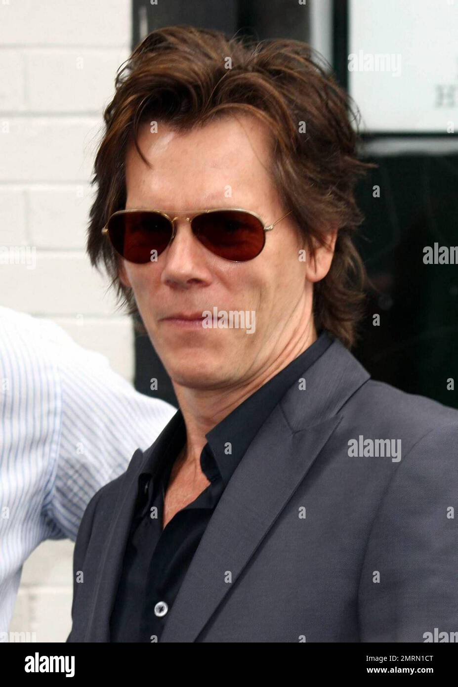 Kevin Bacon arrives at his wife Kyra Sedgwick's star ceremony on the
