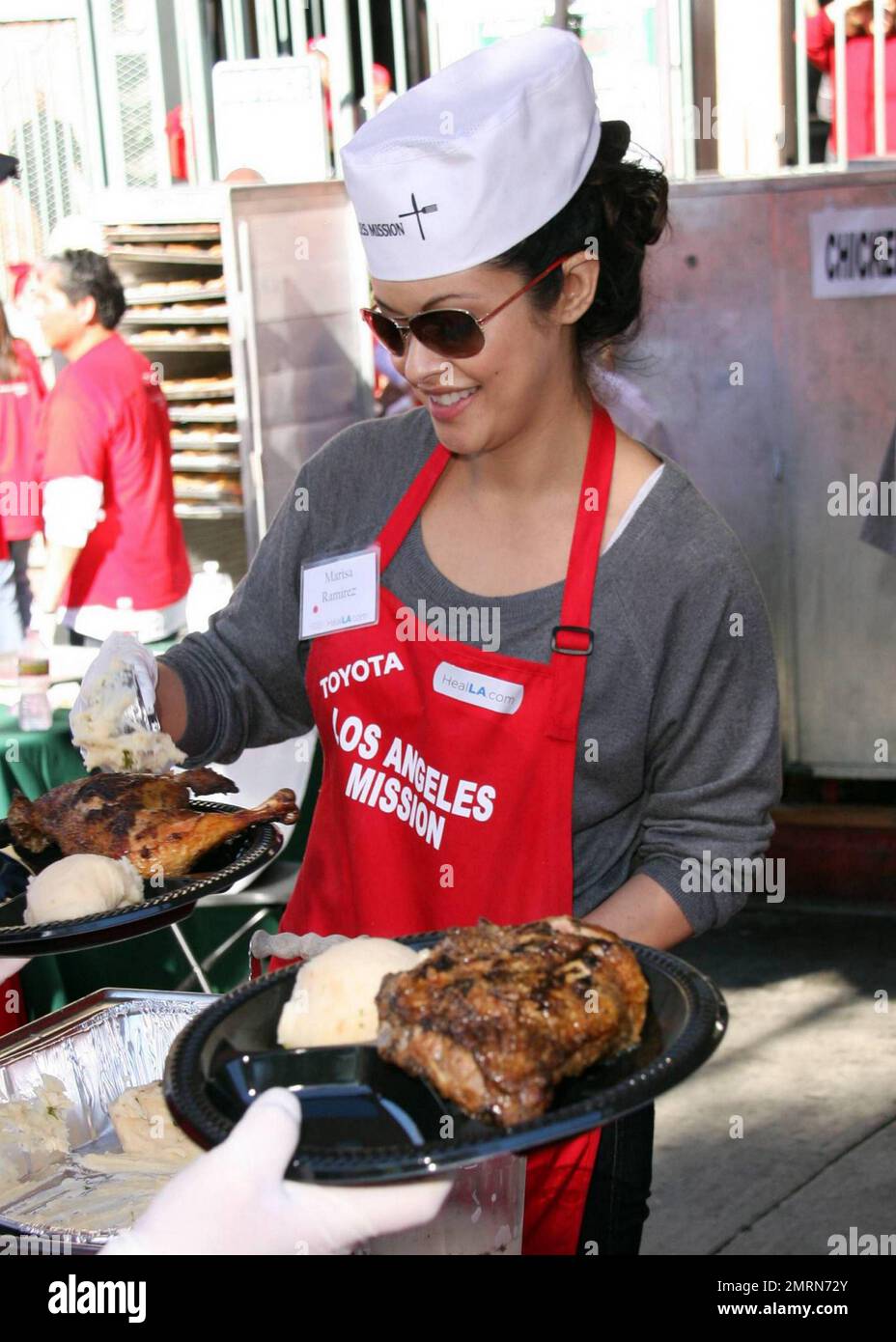 Marisa Ramirez feeds the homeless at the Los Angeles Mission on