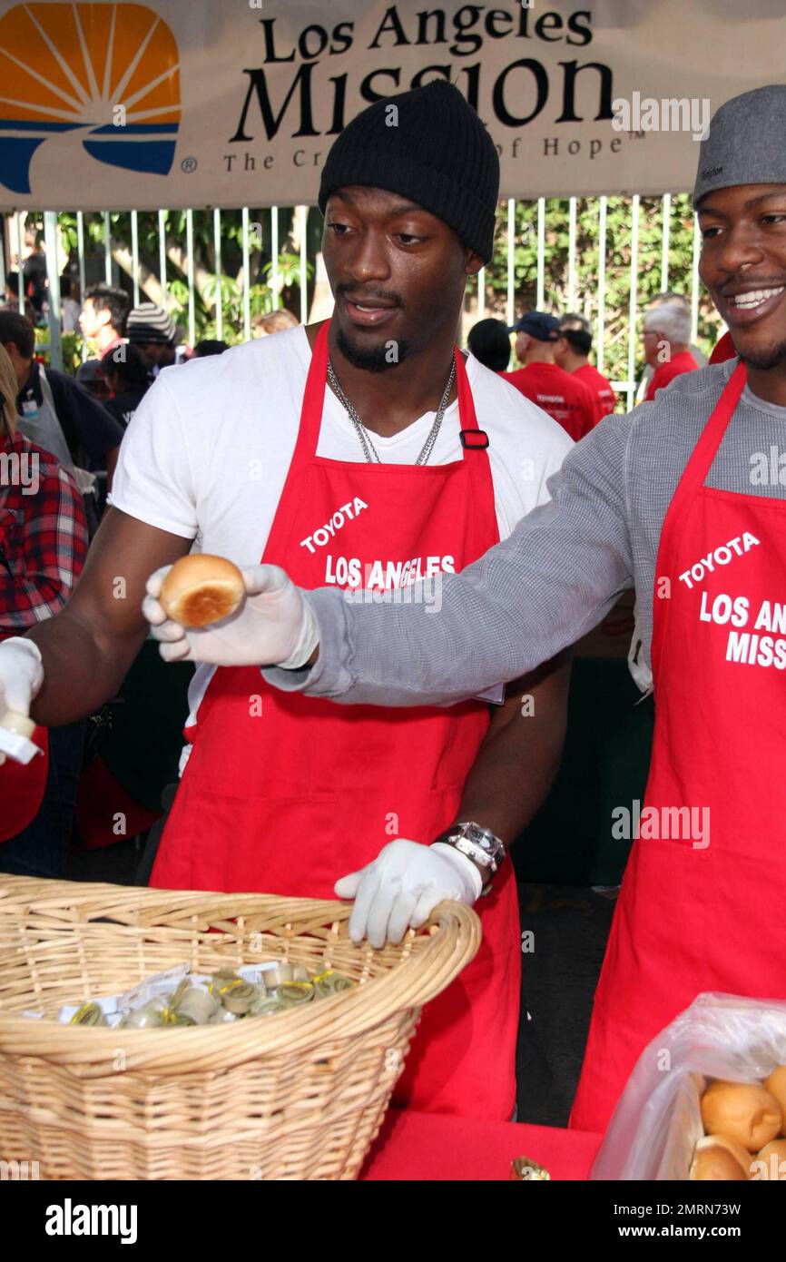 Aldis and Edwin Hodge feed the homeless at the Los Angeles Mission on