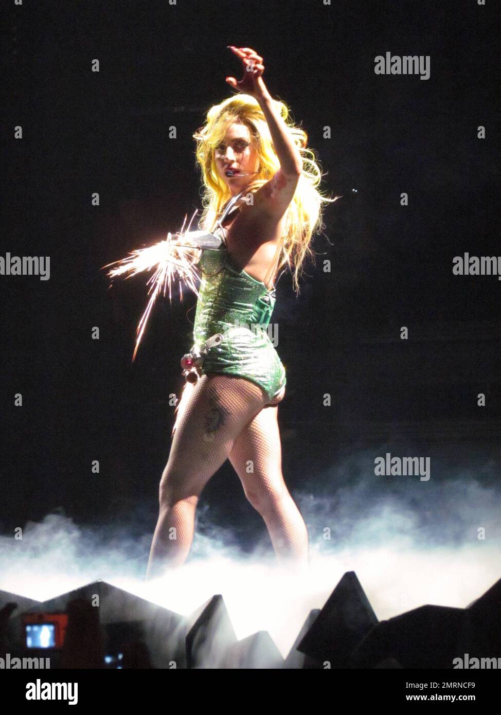 Lady Gaga undergoes several costume changes as she performs live at the  Amway Center, where she also made a point to flash her bum to the audience  while wearing her clear rubber