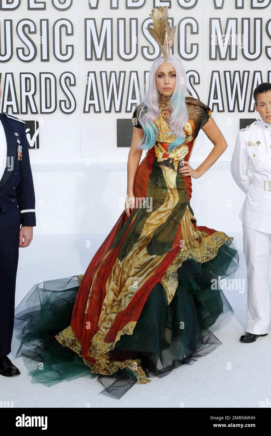 Global pop star Lady Gaga arrives in a patterned tulle gown and gold feather  headdress for the 2010 MTV Video Music Awards held at the Nokia Theatre. At  the beginning of the