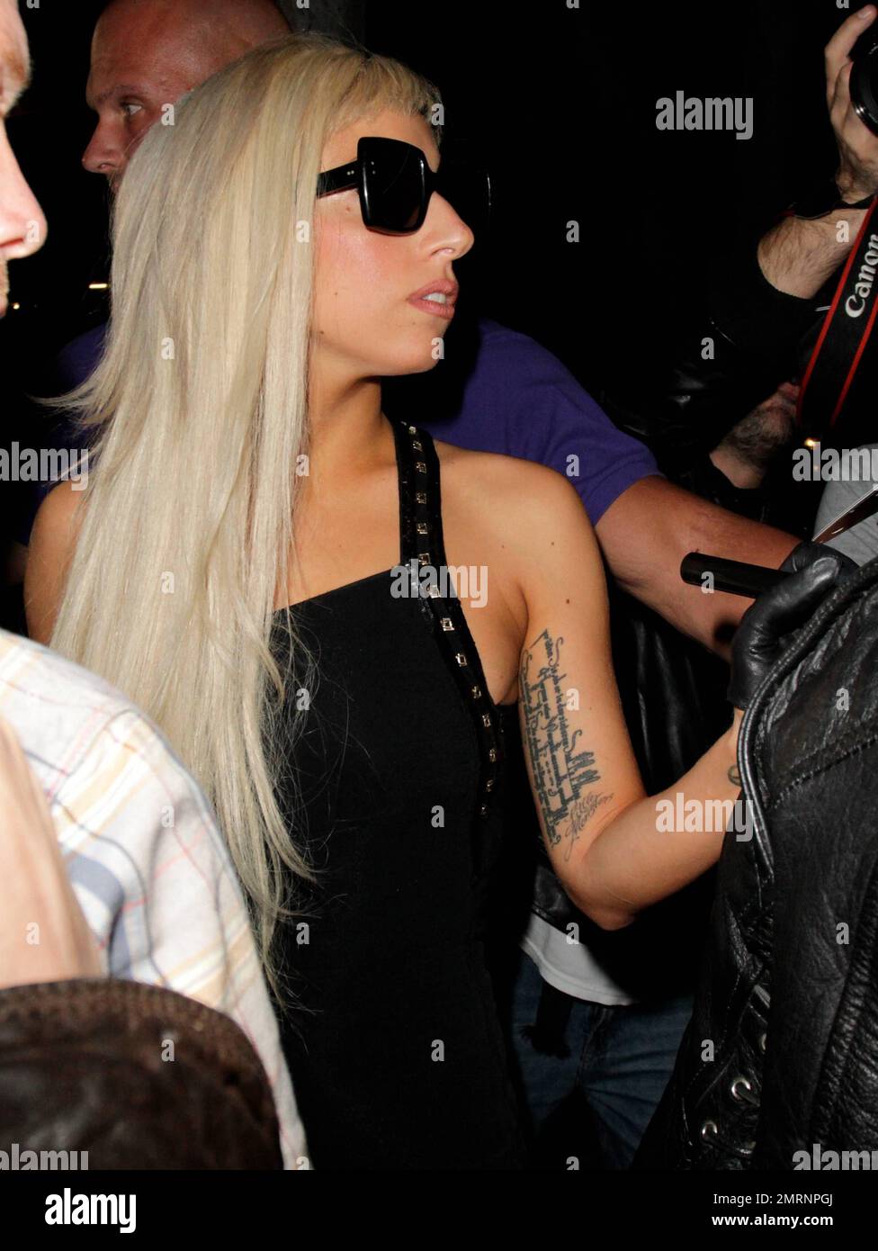 Lady Gaga greets fans, signing autographs and hugging some as she leaves a  recording session after 1AM. The singer donned a floor length black dress  with a sheer lining that revealed her