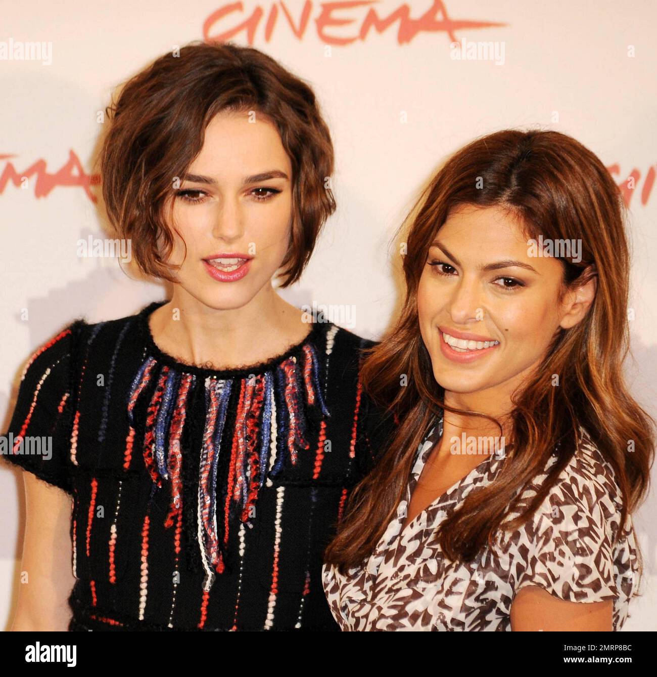 Co-stars Keira Knightley and Eva Mendes look very friendly with each other at the photo call for 'Last Night'.  The romantic drama, which stars Keira Knightley, Sam Worthington and Eva Mendes, will open the 5th International Rome Film Festival. Rome, ITA. 10/28/10. Stock Photo