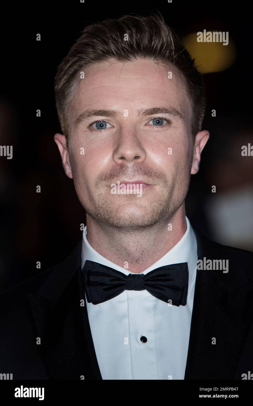 Joe Dempsie poses for photographers upon arrival at the GQ's Men of The