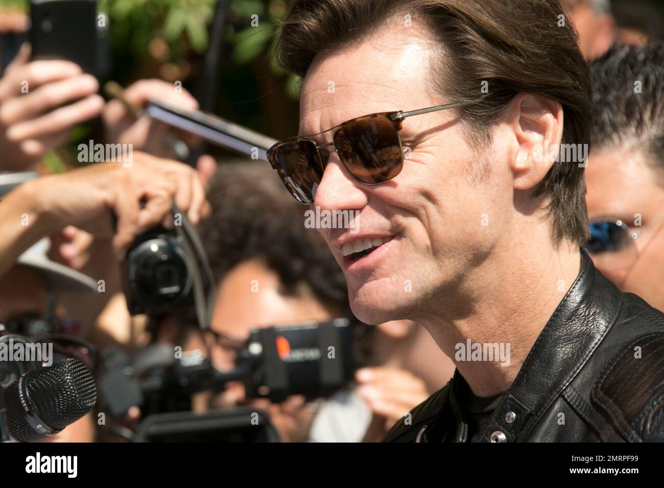 Actor Jim Carrey poses for photographers upon arrival at the press ...