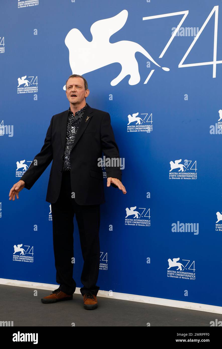 Director David Batty poses for photographers during the photo call of