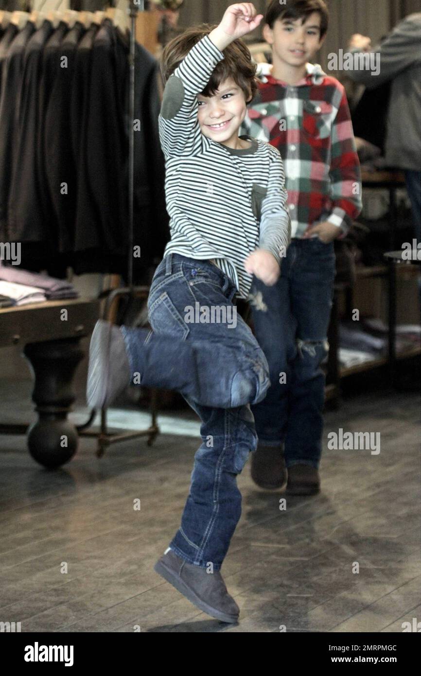 Singer LeAnn Rimes and husband, actor Eddie Cibrian, along with his sons Mason, 7, and Jake, 4, were seen shopping at the Malibu Country Mart. The country superstar wore a brown hat, brown top, blue jeans with black knee high boots and kept it warm with a grey sweater and a rusty colored scarf. 29 year old Rimes was seen joking around and being playful with her husband's sons giving each one hugs and even picking up Jake at one point. The family who appeared to be having a great time together eventually headed out in their black Porsche. Malibu, CA. 11th December 2011. Stock Photo