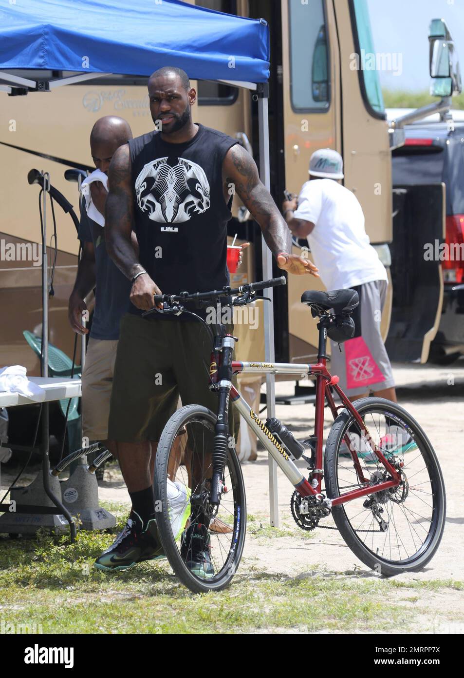 Lebron James films a commercial with a pretty blonde on Ocean Drive in  South Beach. Lebron sported a pair of Nikes as he cycled up and down the  street joined by a