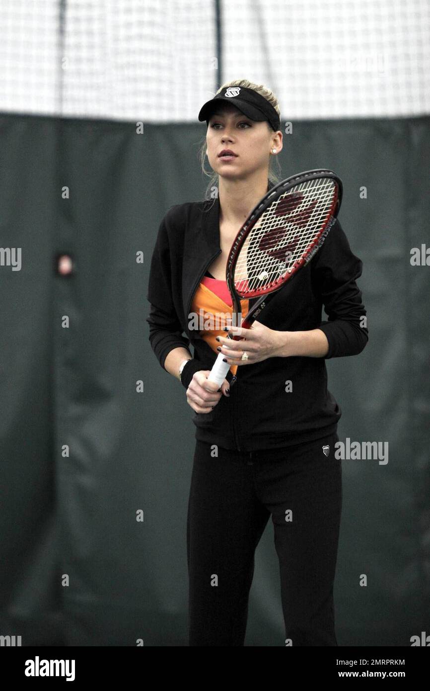 Anna Kournikova warms up before a tennis clinic at Turning Stone Resort and  Casino. Kournikova is participating in the Legendary Night professional  tennis event and opening the new tennis center at the