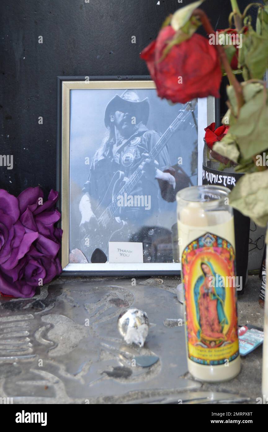 General view of tributes left outside the Rainbow Bar & Grill on the Sunset Strip in honor of Lemmy from the rock band Motorhead, in West Hollywood, CA. Also pictured is a touching note rocker Dave Grohl penned for his friend. Stock Photo