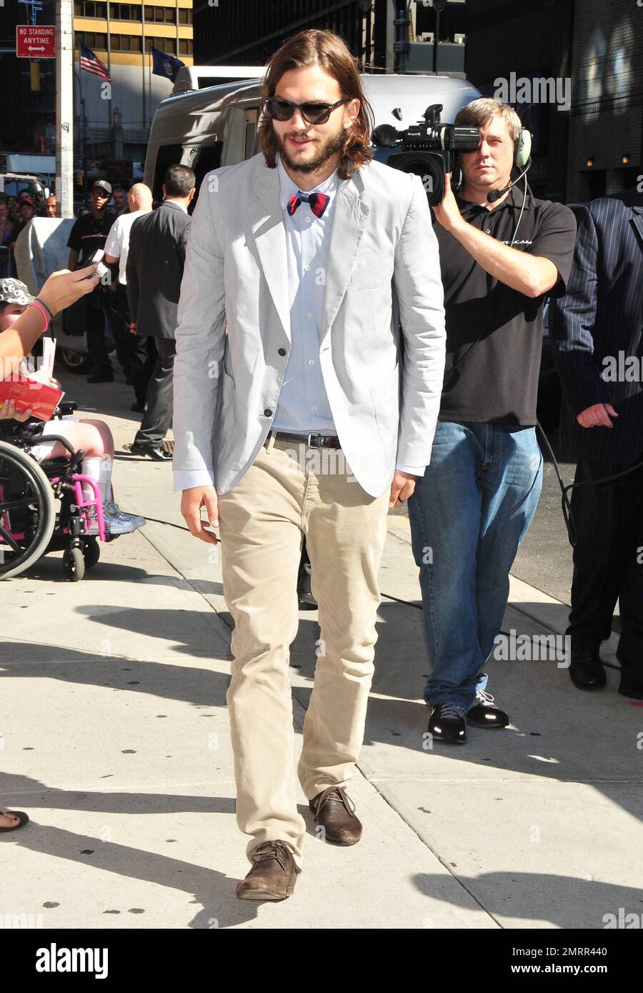 Ashton Kutcher looks like a geeky professor as he poses for photos outside  the "Late Show with David Letterman" studios in New York, NY. 24th August  2011 Stock Photo - Alamy