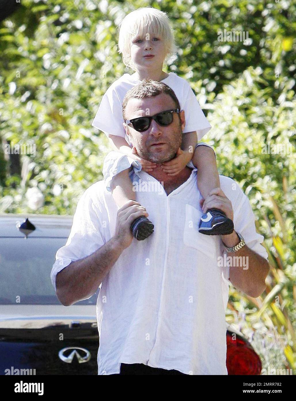 'Salt' actor Liev Schreiber gives son Alexander Pete a piggyback ride while on a walk with friends around the suburbs. Schreiber has recently been reported as saying, 'I think weÕre both ['Salt' co-star Angelina Jolie] in that place with our kids where theyÕre really amazing, right around three-years-old, when all the language starts to come out of them. ItÕs a very exciting period in someoneÕs life, both the childÕs and the parents, and it was fun to bond over that.' Schreiber has two sons with wife Naomi Watts, Alexander and Samuel Kai. Los Angeles, CA. 07/24/10.   . Stock Photo
