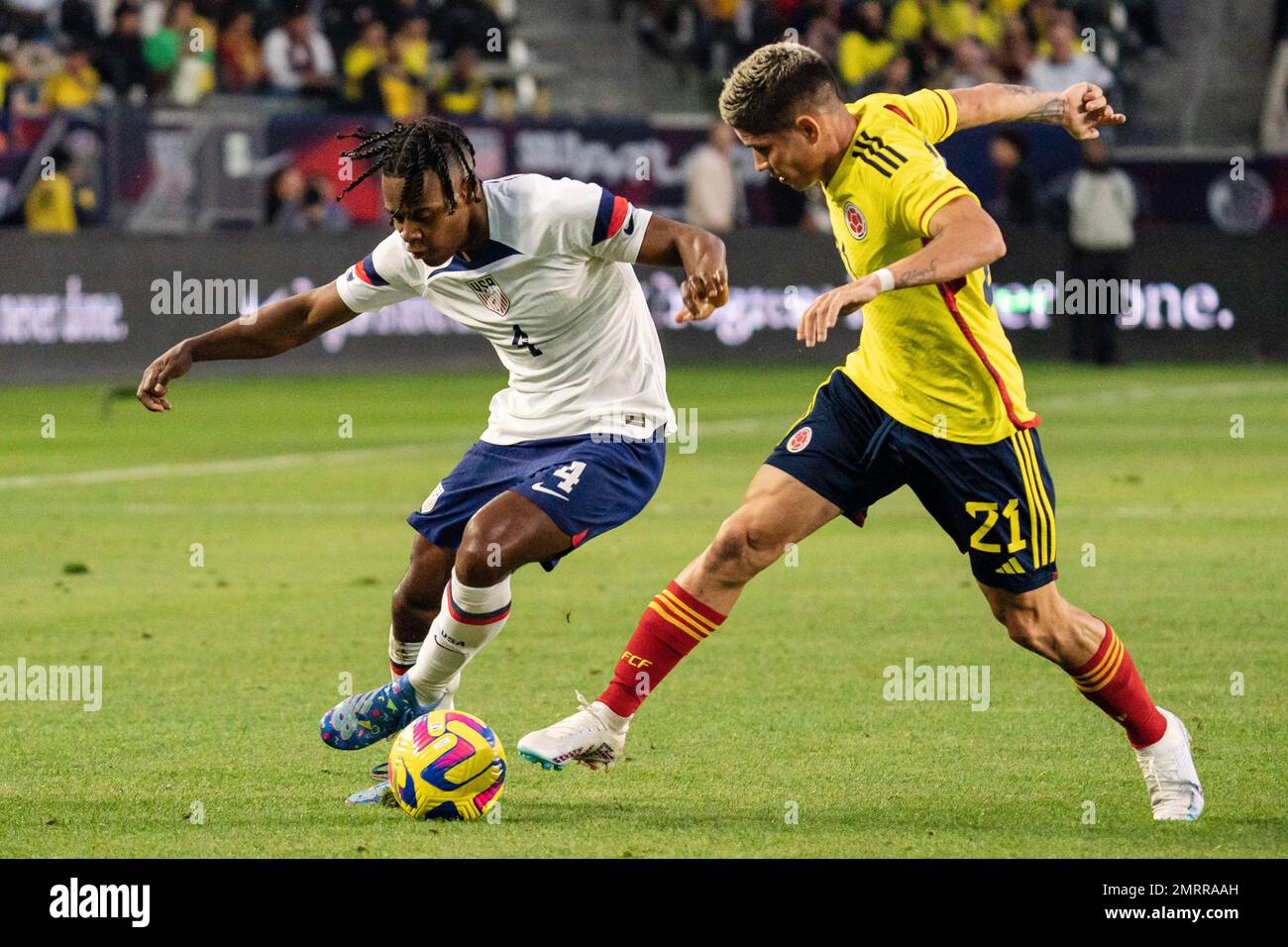 United States of America defender DeJuan Jones (4) and Colombia midfielder Jorman Campuzano (21) fight for possession during an international friendly Stock Photo