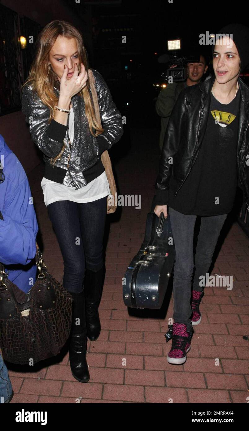 Lindsay Lohan and galpal Samantha Ronson leave Gengis Cohen restaurant