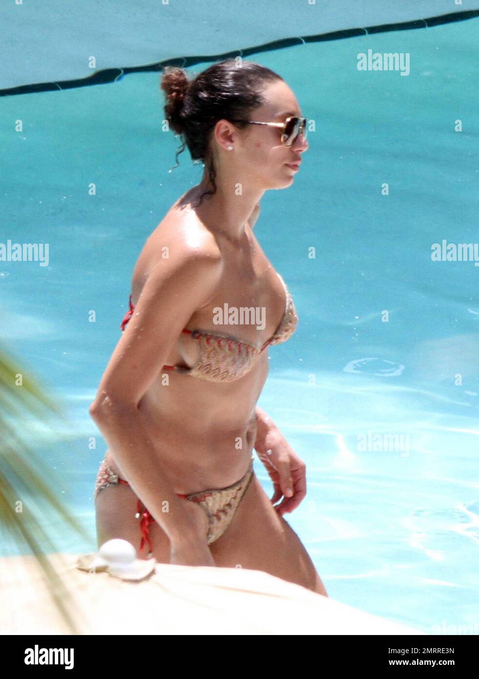 Sharlely Becker's gold bikini struggles to contain her post-baby curves and  almost lost her bikini top following a swim with Boris. Miami, FL. 9/3/10  Stock Photo - Alamy