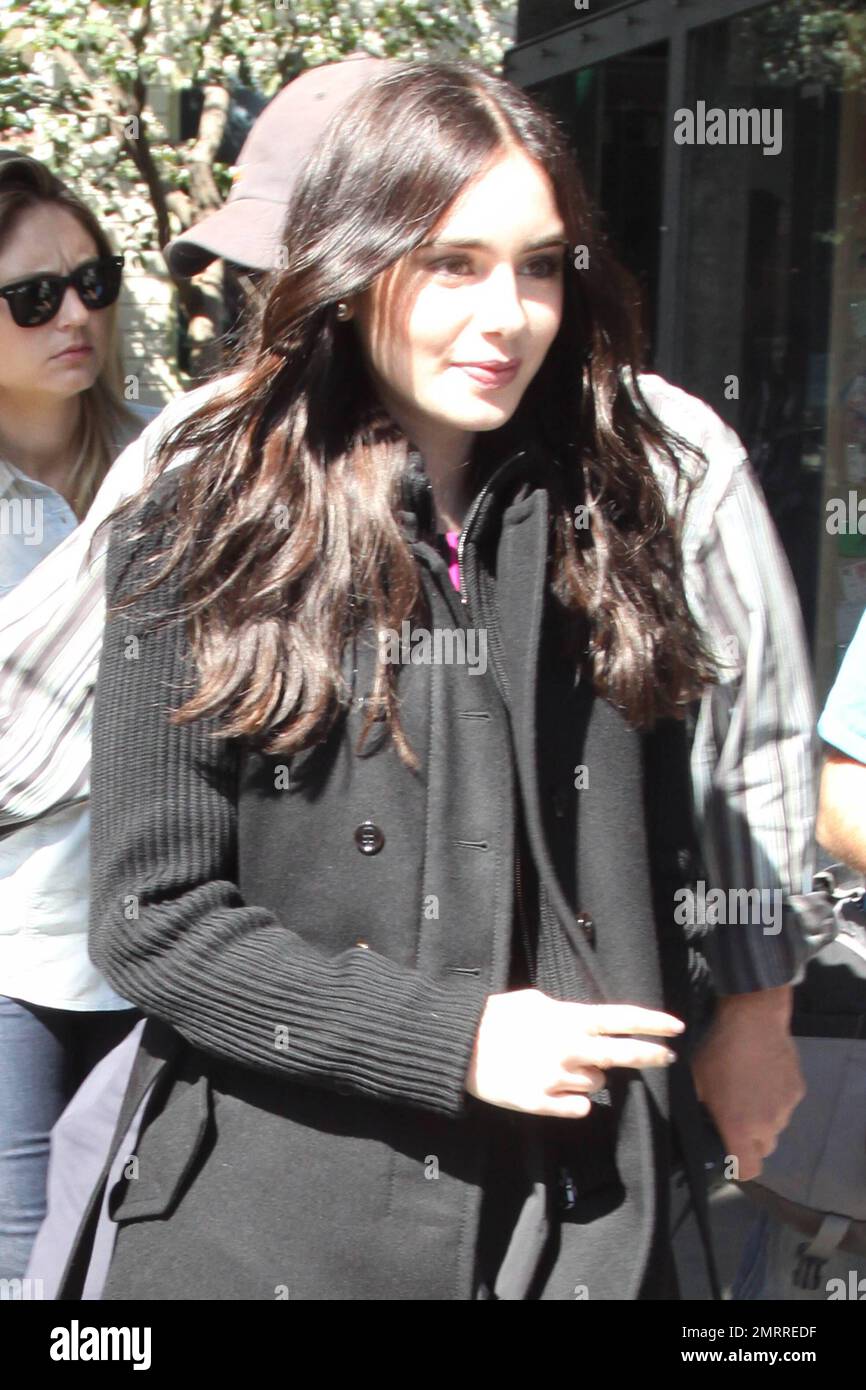Lily Collins, star of the up coming film "Mirror Mirror," was seen arriving  at the Grove shopping center to make an appearance on 'Extra' Entertainment  program. The 23 year old actress covered