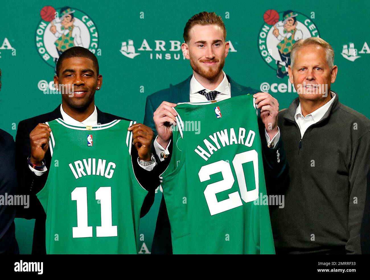 Boston Celtics Kyrie Irving Left And Gordon Hayward Hold Up Their boston-celtics-kyrie-irving-left-and-gordon-hayward-hold-up-their