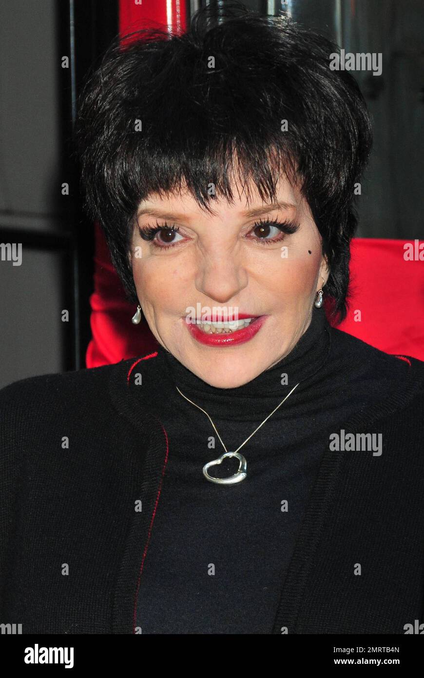 Veteran performer and singer liza minnelli cuts the ribbon cheerfully