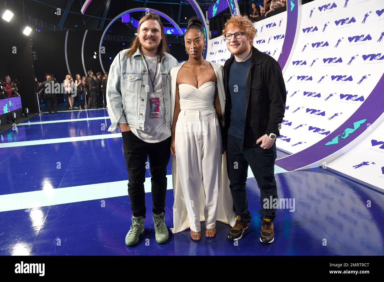 Jason Koenig, from left, Jennie Pegouskie and Ed Sheeran arrives at the