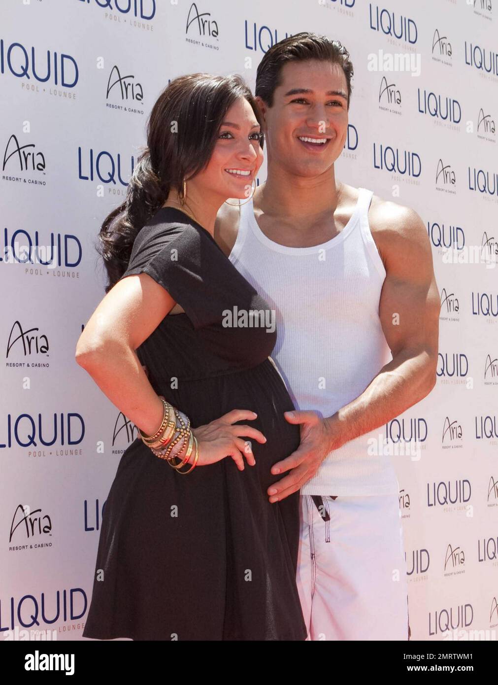 Actor and TV personality Mario Lopez poses with pregnant girlfriend