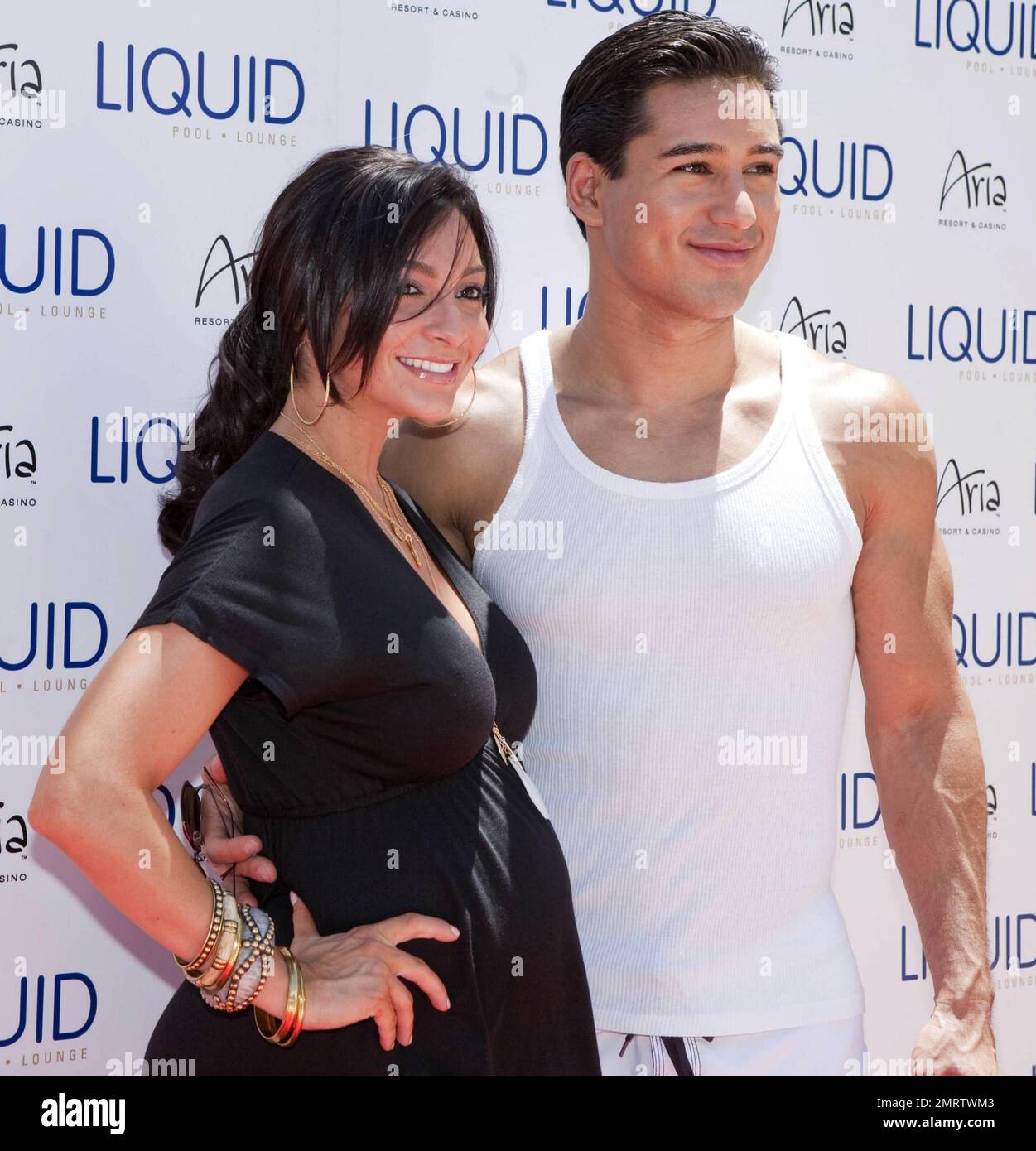 Actor and TV personality Mario Lopez poses with pregnant girlfriend