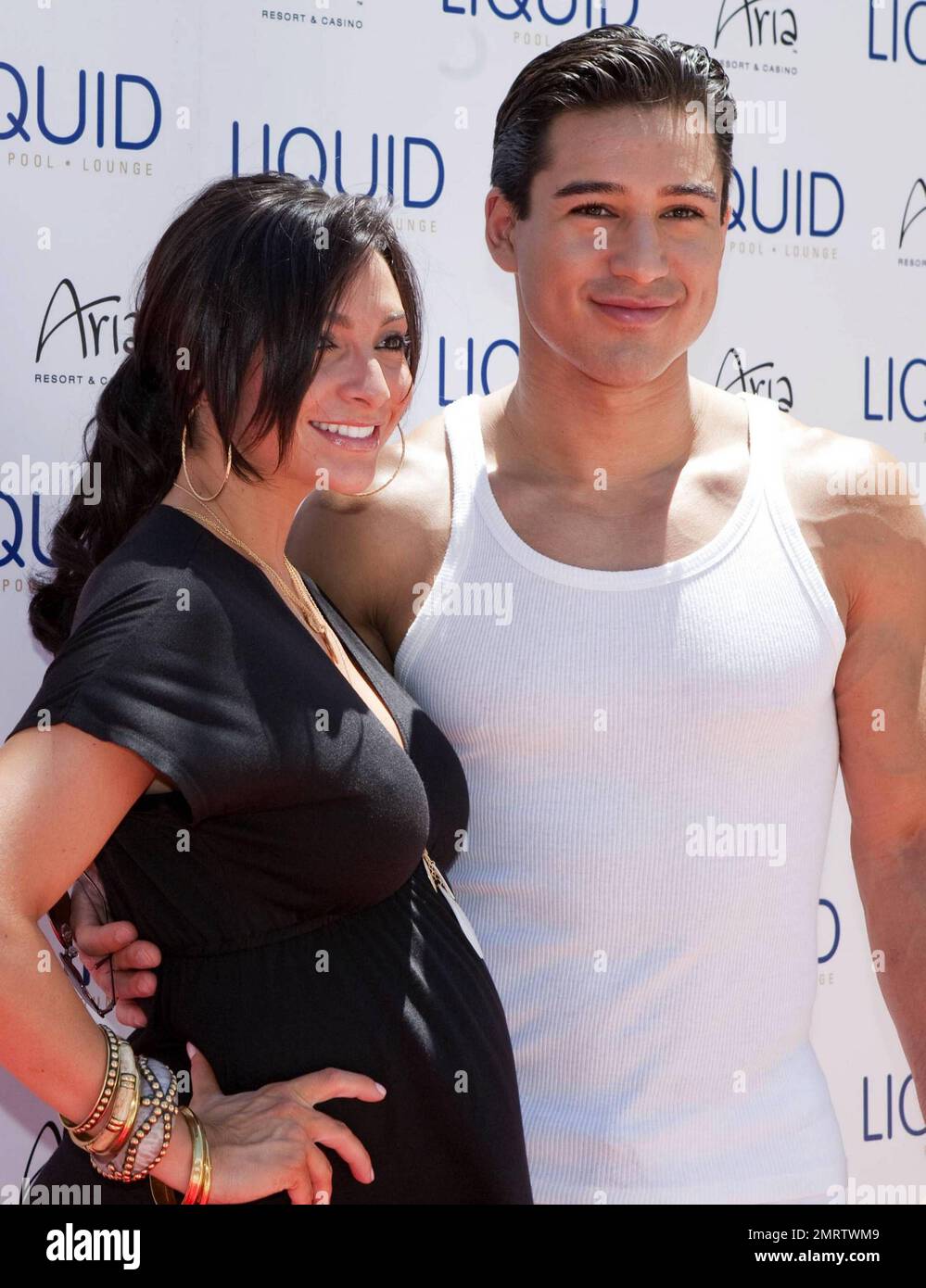 Actor and TV personality Mario Lopez poses with pregnant girlfriend