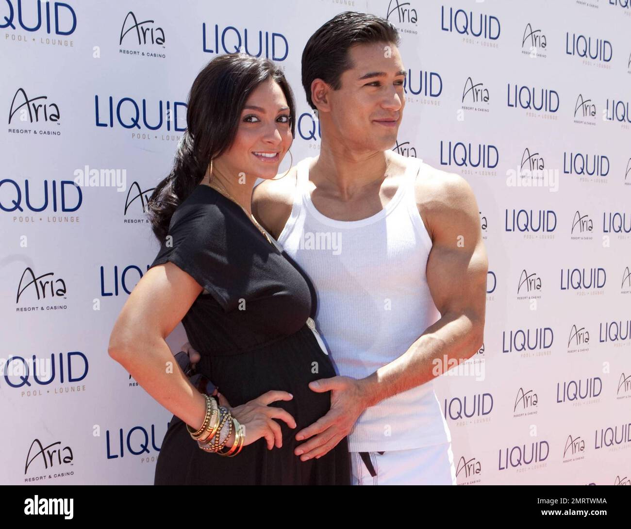 Actor and TV personality Mario Lopez poses with pregnant girlfriend