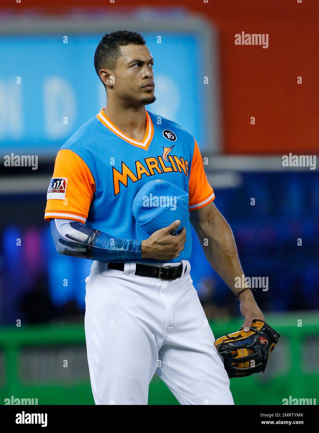 Miami Marlins right fielder Giancarlo Stanton stands during the singing of  the National Anthem before the start of a baseball game against the San  Diego Padres, Sunday, Aug. 27, 2017, in Miami. (