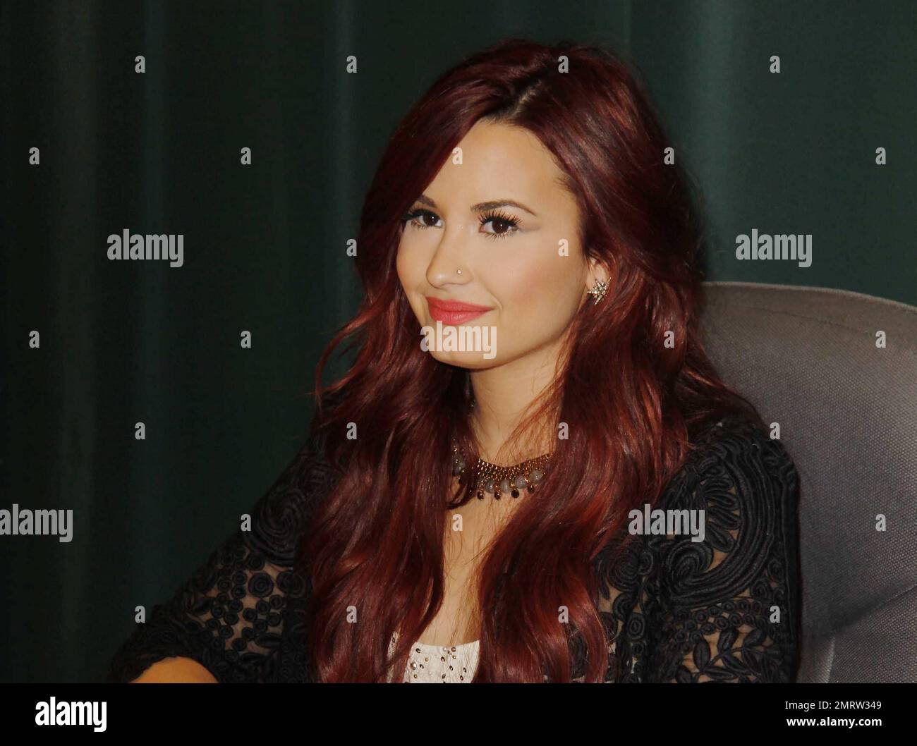 Demi Lovato shows off her super red hair as she makes an