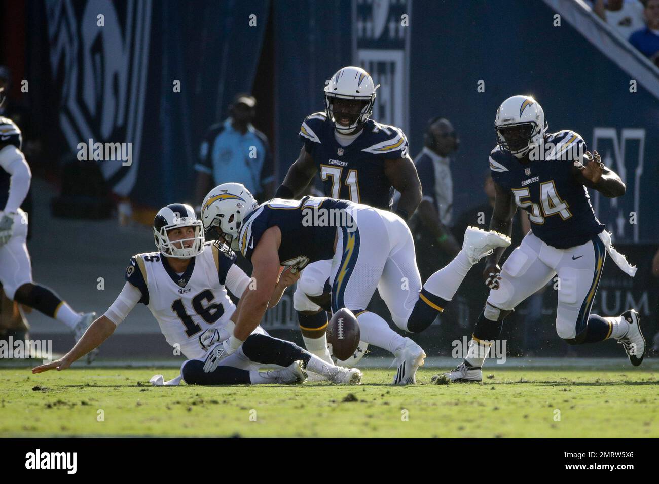 Los Angeles Rams quarterback Jared Goff fumbles as he is hit by Los ...