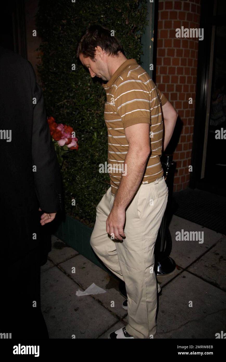 Luke Wilson leaves the restaurant Mr. Chow after having dinner and sitting for a bit with Steve Tisch and his daughter. He does his best to keep his head down and completely covers up once in the waiting SUV. Could Luke have been meeting Tisch about being cast in an upcoming film? Los Angeles, CA. 9/24/08. Stock Photo
