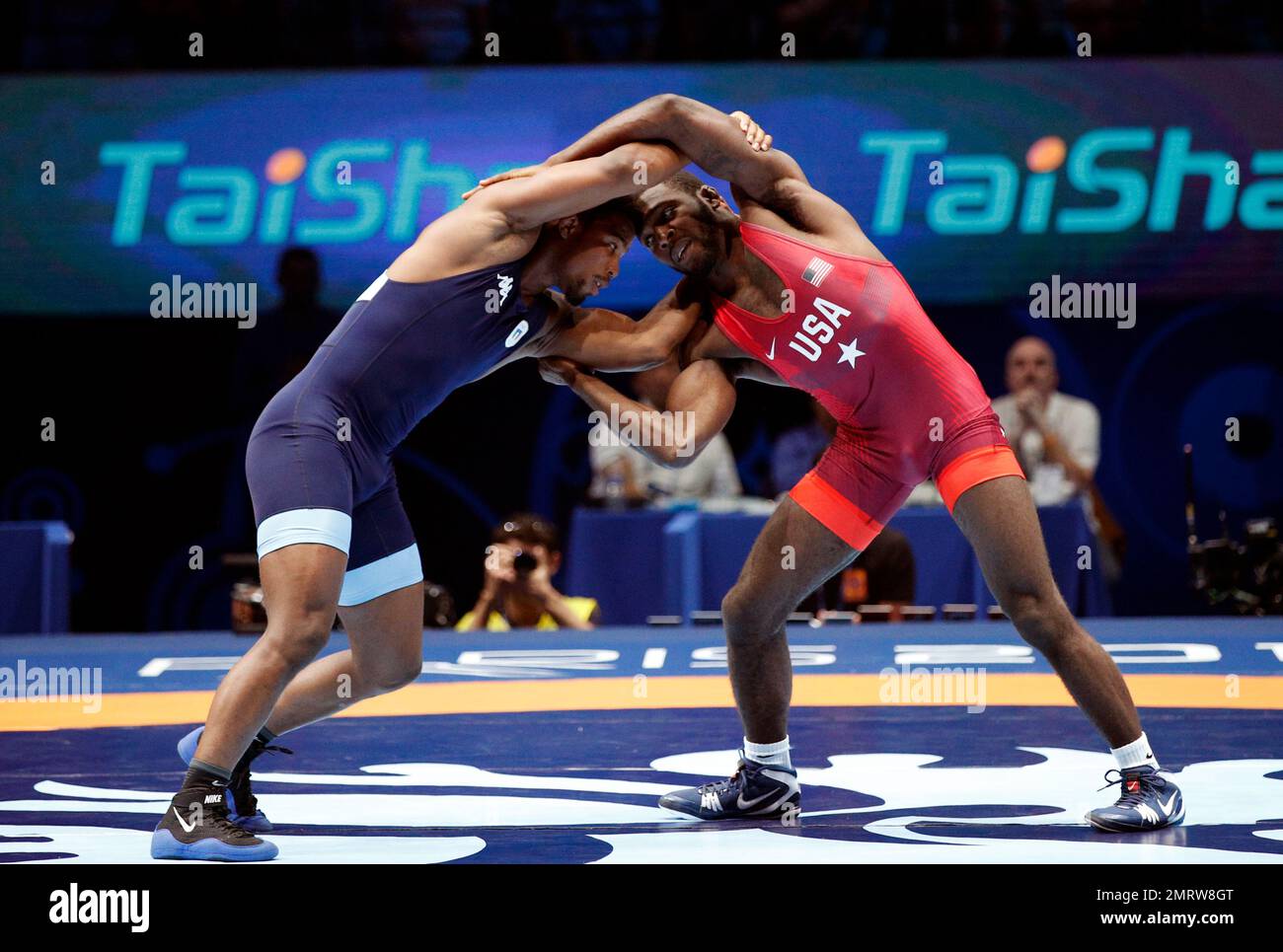 United States' James Malcom Green, right, and Frank Chamizo Marquez of  Italy compete in the men's free style 70 kg category during the final of  the Wrestling World Cup at the Paris