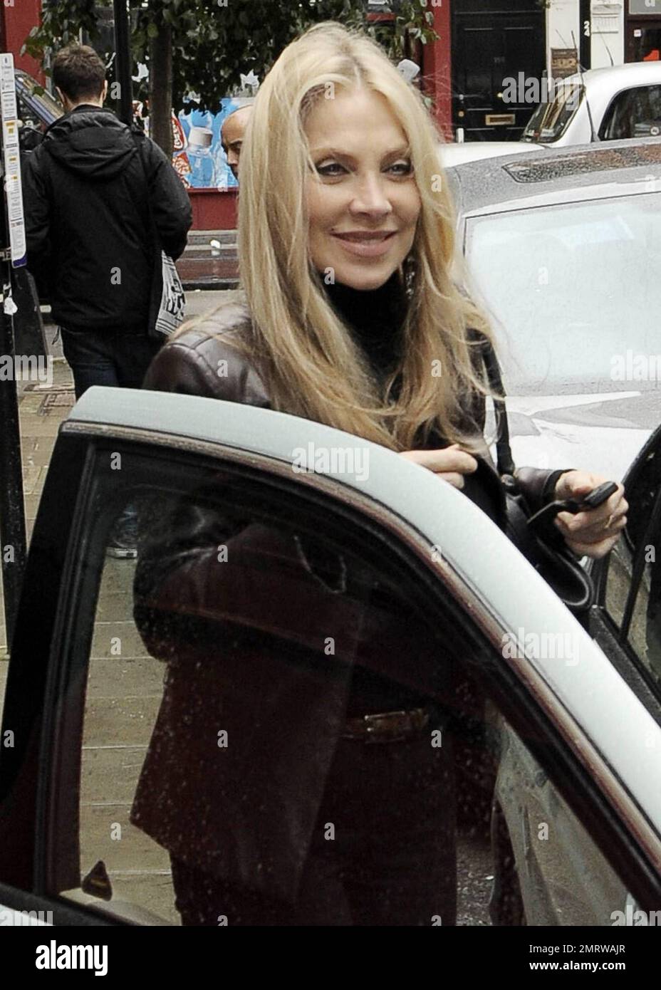 60 Year Old British Pop Singer Lynsey De Paul Smiles For The Camera Before She Gets In To A