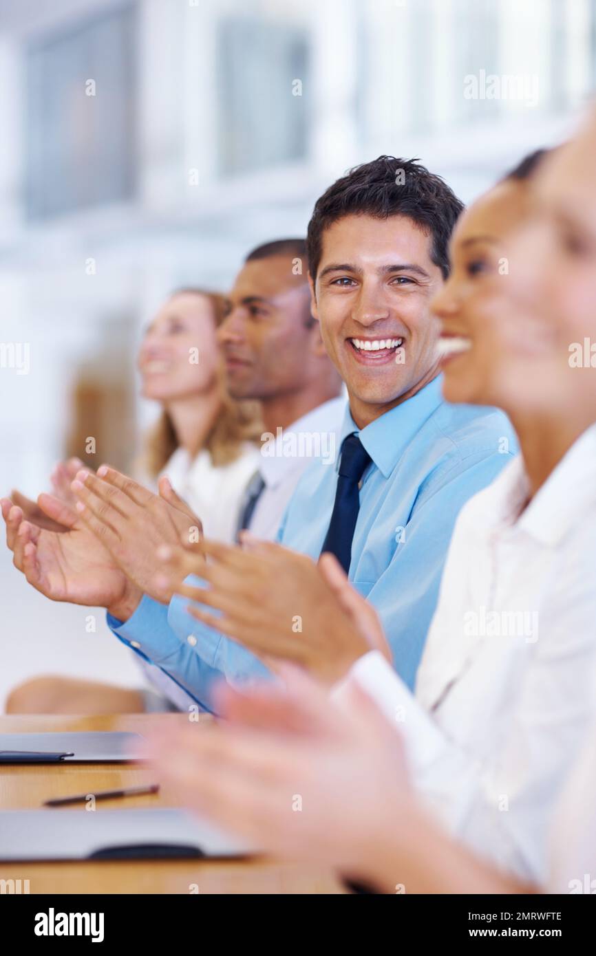 Successful meeting. Portrait of happy professionals clapping after successful meeting. Stock Photo