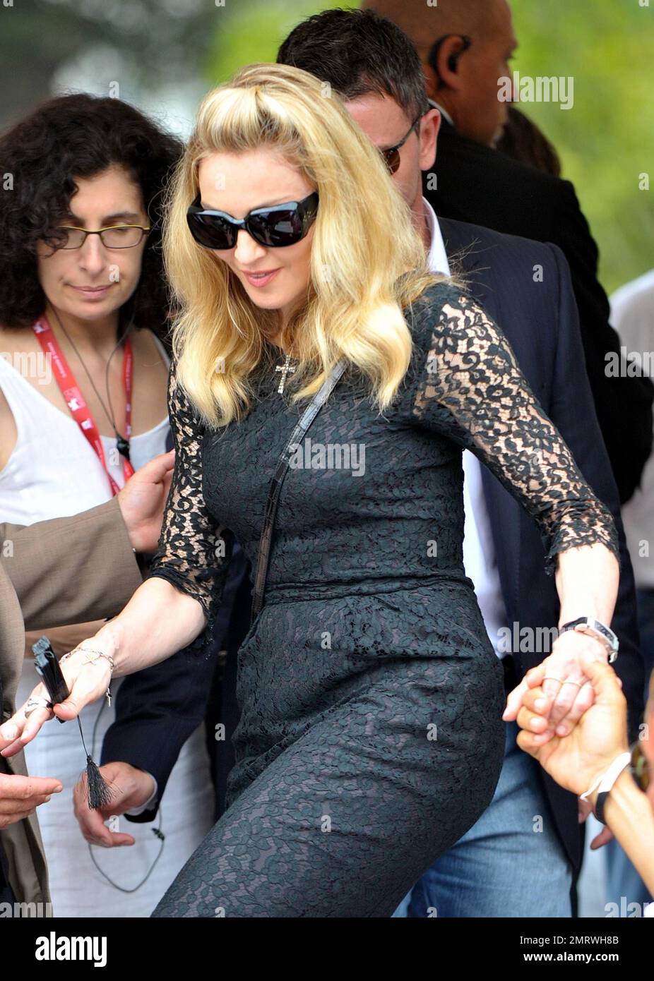 USA ONLY - Madonna wears a black lace dress as she gets on a boat while  heading to the Gucci party prior to the premiere of "A Dangerous Method,"  while in Italy