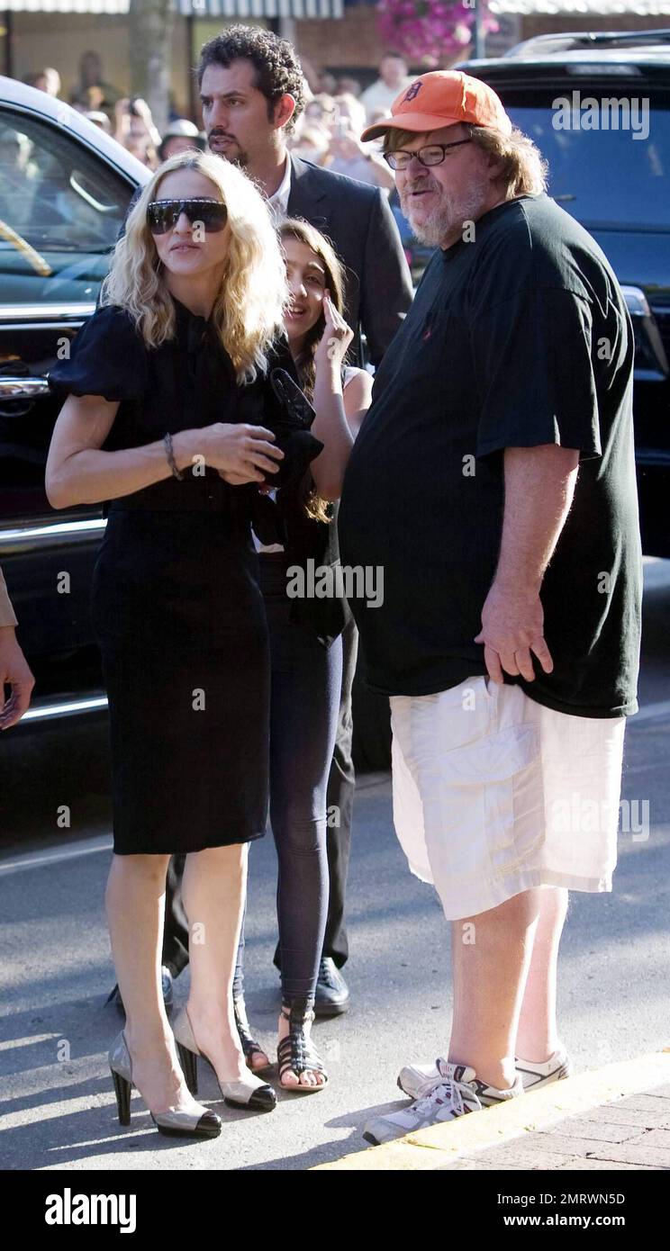 Madonna and Michael Moore arrive at the State Theatre for the screening of her movie 'I Am Because We Are' during the Traverse City Film Festival.  The documentary looks at Malawi's 1 million plus orphans in the wake of the AIDS pandemic. It offers hope and real solutions to the challenges that people face living in extreme poverty. It was written by Madonna and directed by Nathan Rissman. Traverse City, Michigan. 8/2/08 Stock Photo