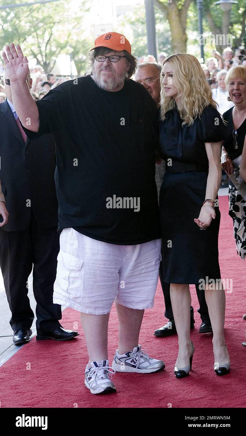 Madonna and Michael Moore arrive at the State Theatre for the screening of her movie 'I Am Because We Are' during the Traverse City Film Festival.  The documentary looks at Malawi's 1 million plus orphans in the wake of the AIDS pandemic. It offers hope and real solutions to the challenges that people face living in extreme poverty. It was written by Madonna and directed by Nathan Rissman. Traverse City, Michigan. 8/2/08 Stock Photo