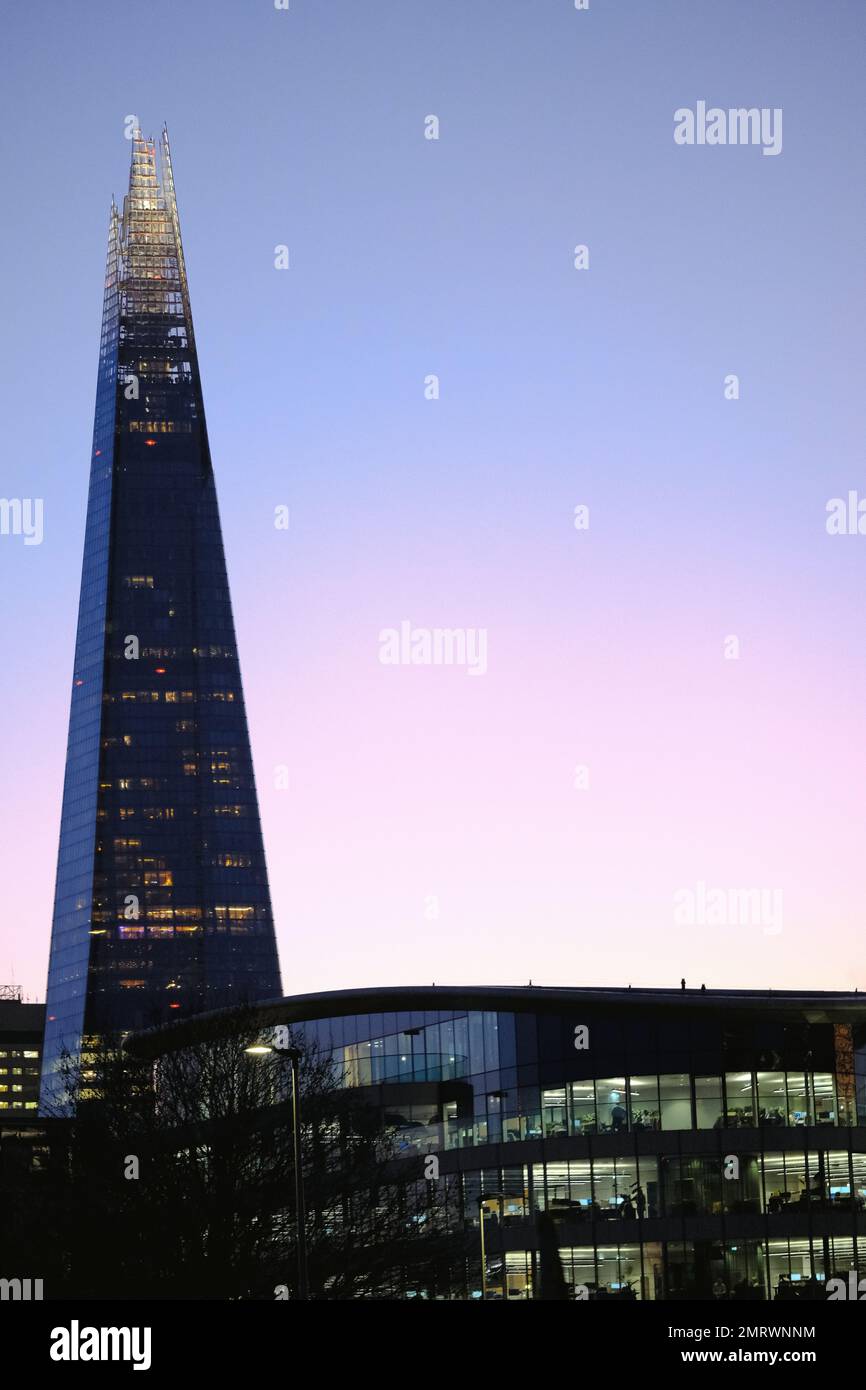 A beautiful scenery of The Shard skyscraper during s beautiful purple gradient sunset Stock Photo