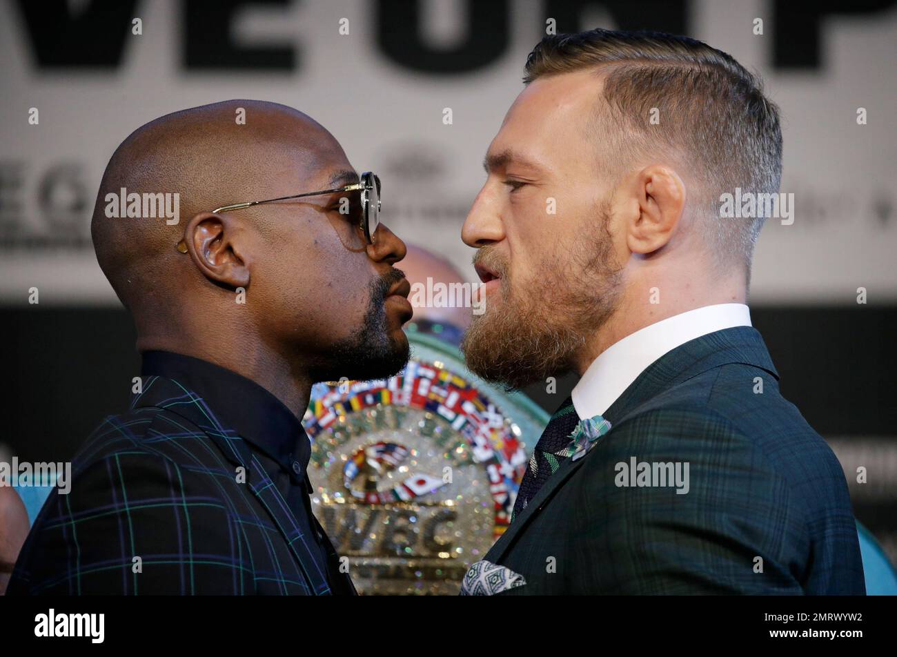 Floyd Mayweather Jr., left, and Conor McGregor pose for photographers  during a news conference Wednesday, Aug. 23, 2017, in Las Vegas. The two  are scheduled to fight in a boxing match Saturday