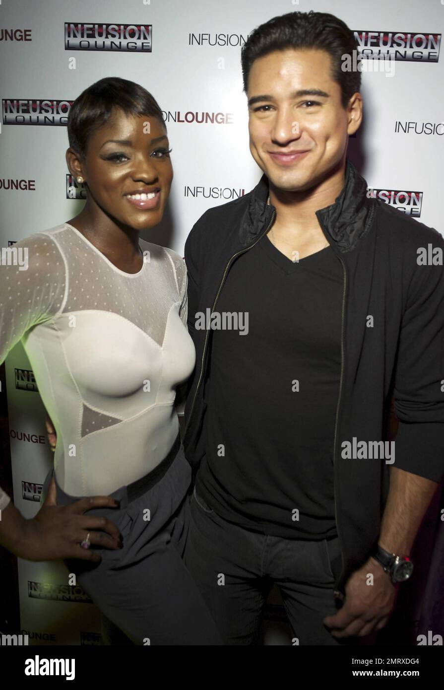 EXCLUSIVE!! "Extra" host Mario Lopez poses for photos with fans during an  appearance at Infusion nightclub\