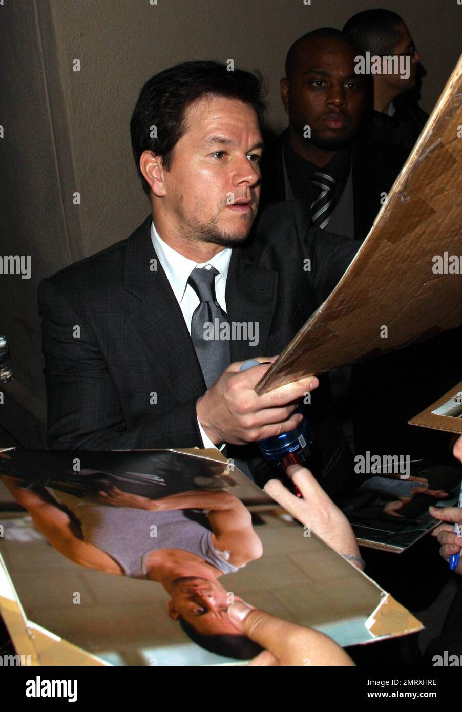 Mark Wahlberg signs autographs for and poses for photos with fans ...