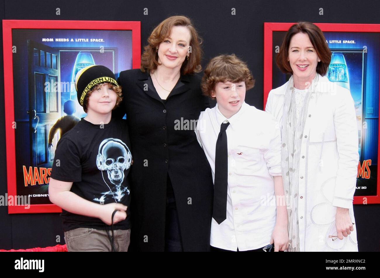 Actress Joan Cusack and sons Dylan John and Miles pose for