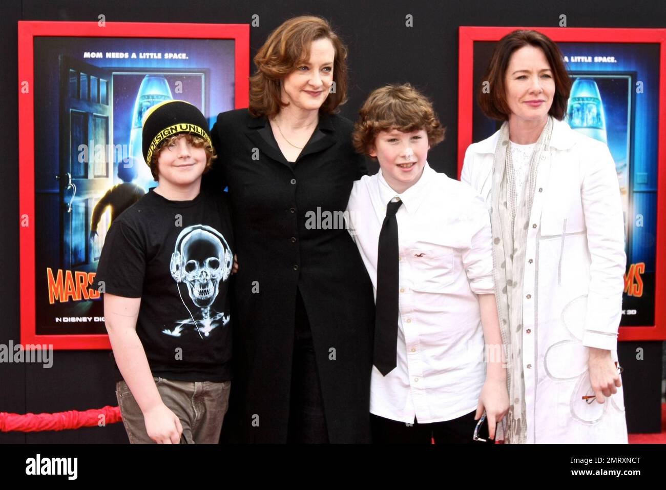 Actress Joan Cusack and sons Dylan John and Miles pose for photographers on the red carpet at