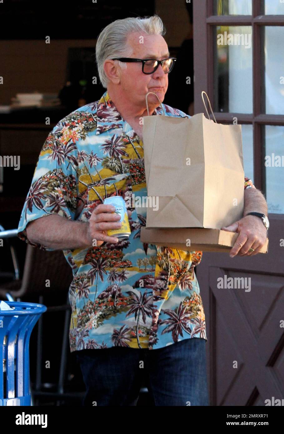 Actor Martin Sheen was seen picking up food to go from Howdy's restaurant in Malibu and driving off in his vehicle which displayed Obama and anti-war bumper stickers. Malibu, CA. 28th July 2012   . Stock Photo