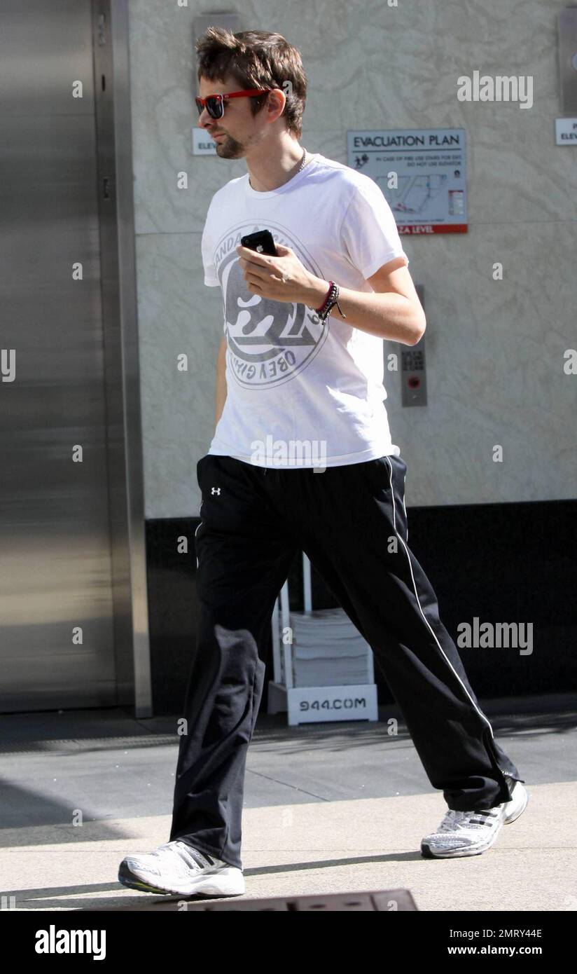 Kate Hudson's boyfriend and guitarist and lead vocalist for the band Muse, Matthew Bellamy strolls casually as he arrives for a workout at a local gym. Matthew and Kate announced last month that they are expecting their first baby together. Kate, who has a son, Ryder, 7, with ex-husband Chris Robinson has been dating Bellamy for about ten months. Los Angeles, CA. 2/17/11. Stock Photo