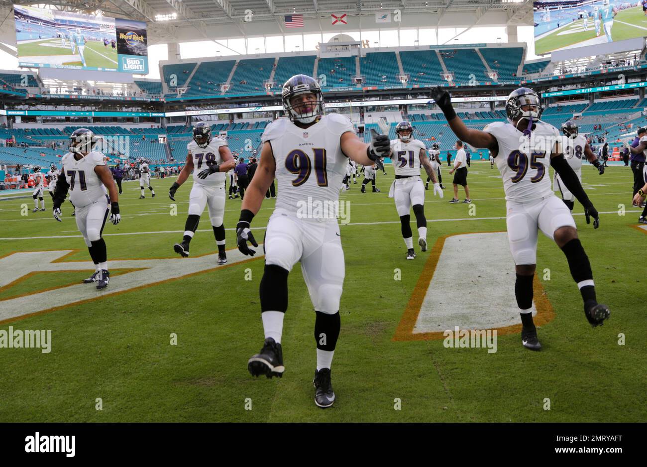 Buffalo Bills quarterback T.J. Yates (9) throws under pressure from Baltimore  Ravens defensive end Patrick Ricard (91) during the second half of an NFL  preseason game at M&T Bank Stadium in Baltimore