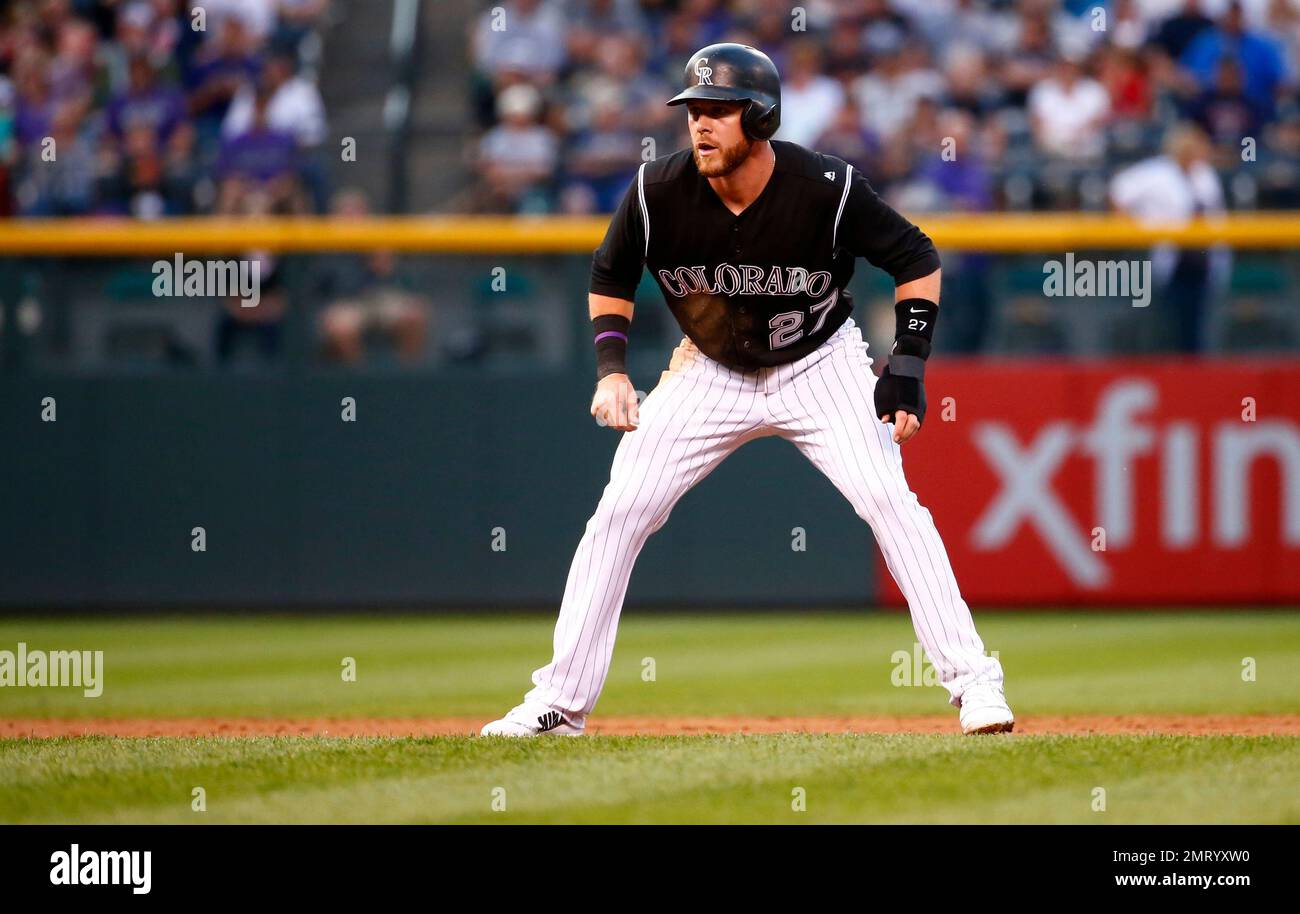 Colorado Rockies' Trevor Story looks skyward as he arrives home after  hitting a solo home run during the eighth inning of the team's baseball  game against the St. Louis Cardinals on Tuesday