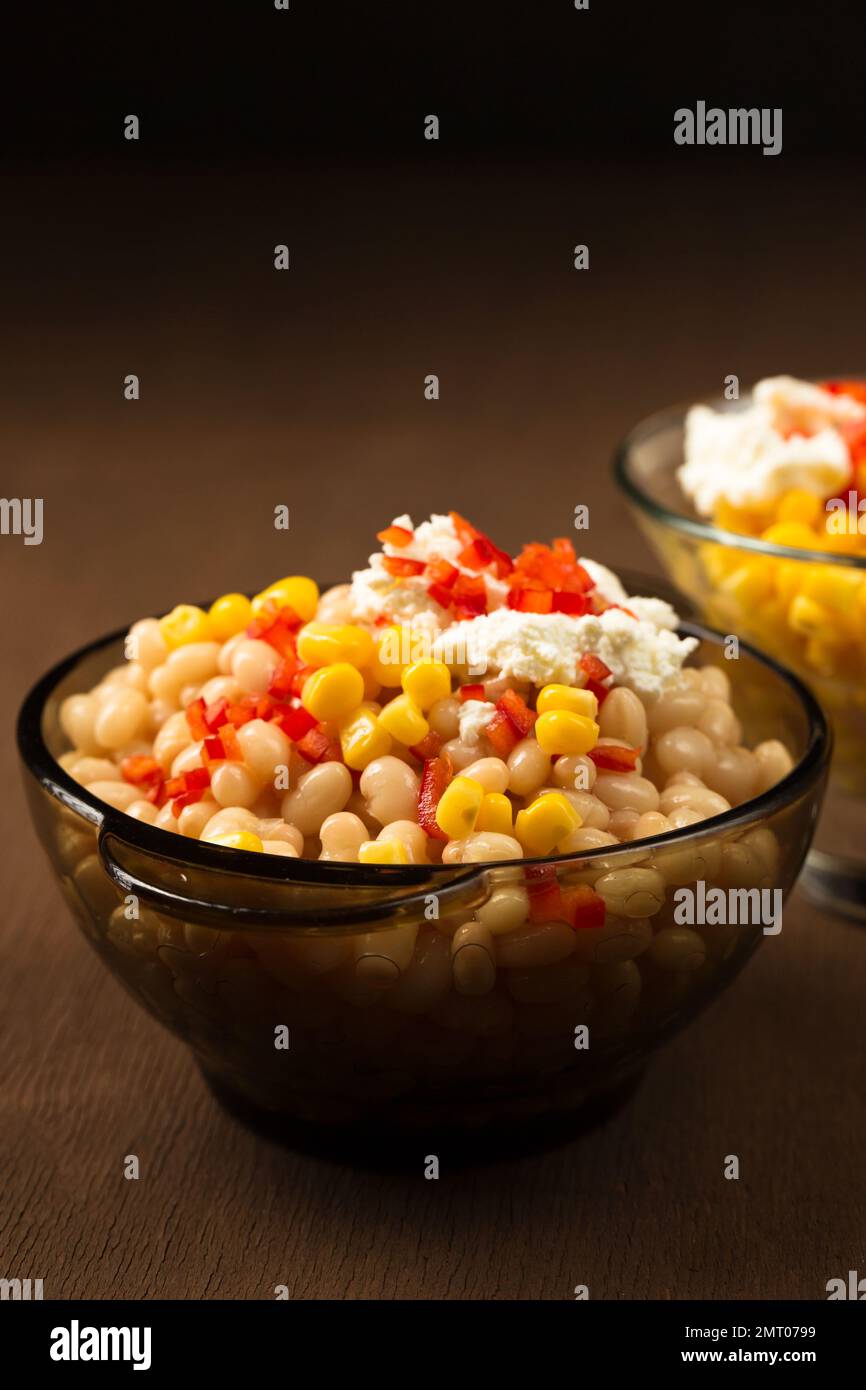 Esquites with corn and white Kidney beans, cheese, mayonnaise and chili